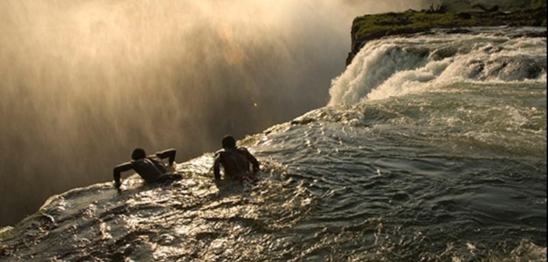 Point of view looking drop with rushing water and no barrier