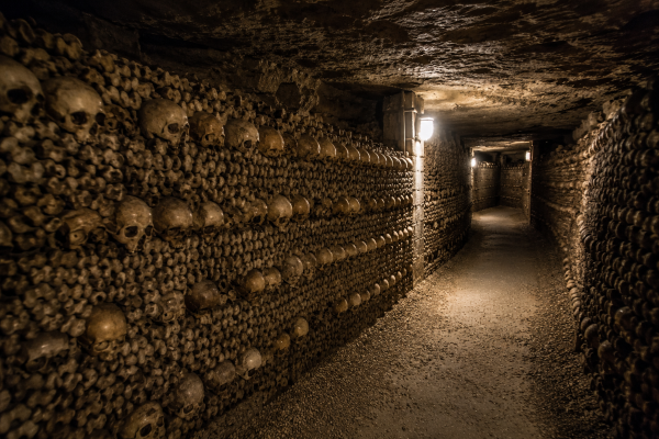 Explore the terrifying Catacombs of Paris, an underground maze filled with millions of human bones, dark history, hidden tunnels, and eerie mysteries beneath the streets of France.